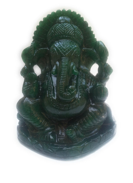 Green jade statue of Hindu deity Ganesha with detailed carvings and multiple arms
